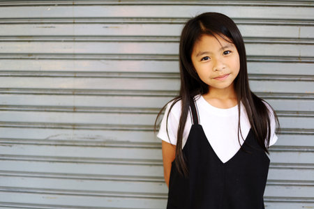 Beautiful girl happy and smile portrait on walking street at outdoor.