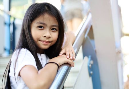 Beautiful kid girl happy smile portrait and traveling in the city on holiday weekend.の写真素材