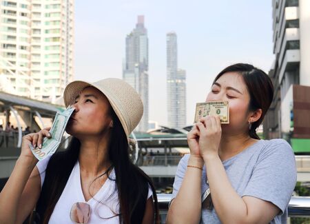 Beautiful girl is happy When receiving bonuses for traveling at the end of the year.の写真素材