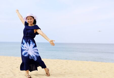 Beautiful Asia woman smile portrait and traveling summer on beach at Phuket, Thailand.の写真素材