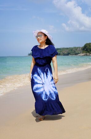 Beautiful Asia young woman smile portrait on the beach in summer at Phuket, Thailand.の写真素材