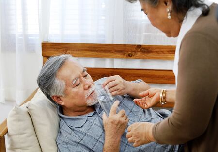Elderly couple lover care and concern In a sick time at home.の写真素材