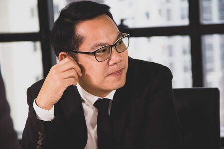 Happiness Asia business man manager working job at desk.の写真素材