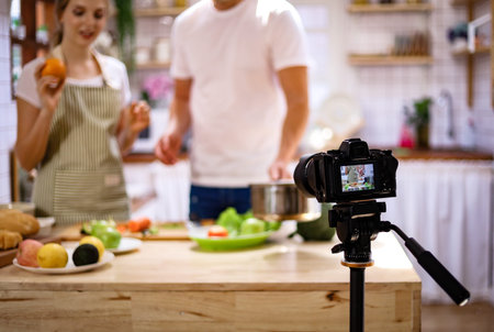 Young couples are enjoying cooking at the kitchen in working from home, COVID-19.