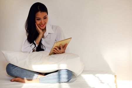 Happiness young woman smile stay at home and working business from home.の写真素材