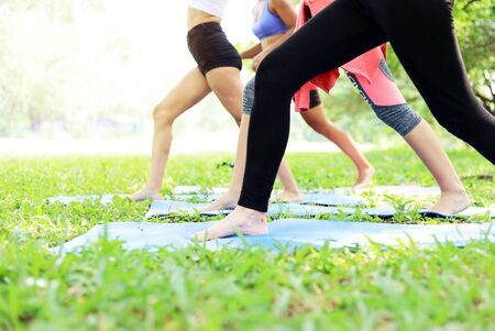 Happiness young woman friendship enjoyment and playing yoga at garden park.の写真素材