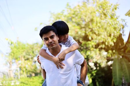 Happiness young family in holiday activities weekend at garden park.の写真素材