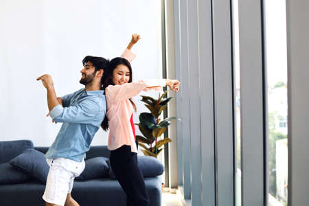 Happiness young couple dancing activities for working from home at home and stay at home.の写真素材