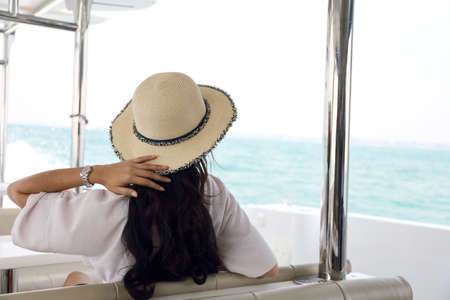Happiness young woman sexy relaxation and traveling on boat in summer holiday at Pattaya, Thailand.の写真素材
