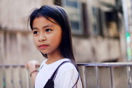 Beautiful happiness Asia child girl smile portrait traveling on holiday weekend.の写真素材