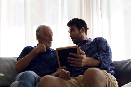 Father and son talking and sharing discussion lifestyle for domestic life at home.の写真素材