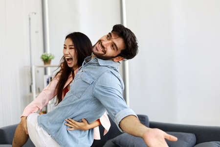 Happiness young couple having fun and dancing for stay home from protection corona virus.の写真素材
