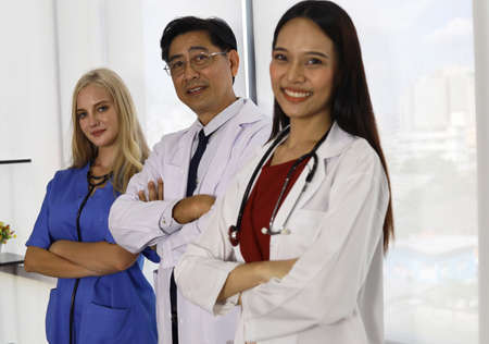 Happiness teamwork doctor talking and discuss in hospital.の写真素材