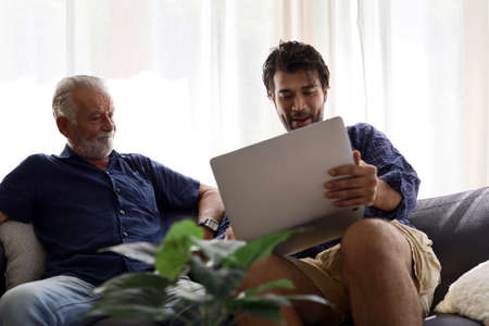 Father and son, discussing business at home, are in trouble at home.の写真素材