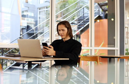 Coffee shop owner presenting a store on social media at coffee cafe.
