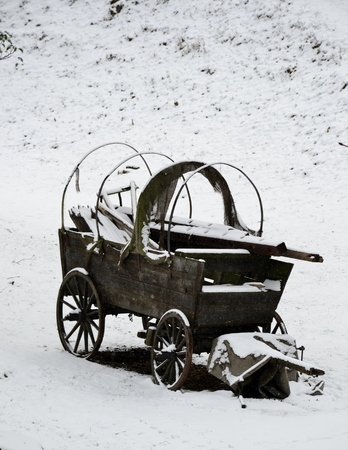 Old wooden stage coach with snowの写真素材