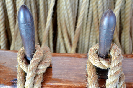 Details of tied rope from boat and wooden tools with background