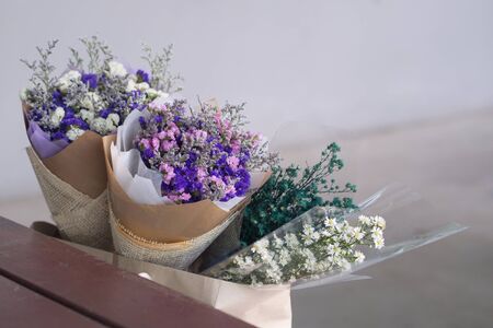 Gypsophila flower panicle near brown wood tableの写真素材