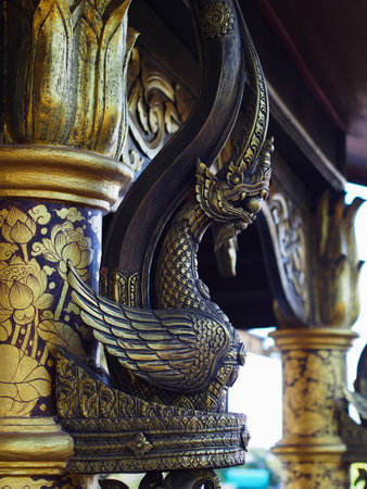 Garuda statue carry a marble in a temple of Thailandの写真素材