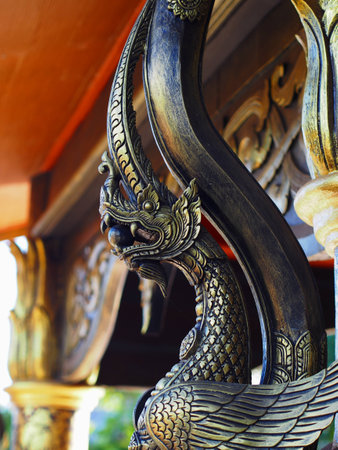 Garuda statue carry a marble in a temple of Thailandの写真素材