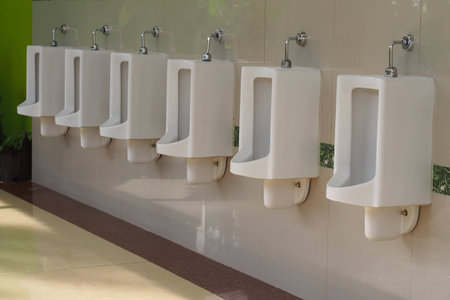 White urinals at public toilet.の写真素材
