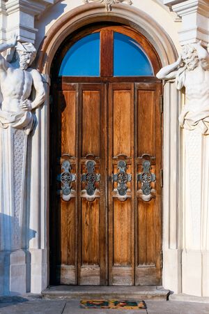 Door with atlants at the baroque Wilanow Royal Palaceのeditorial素材