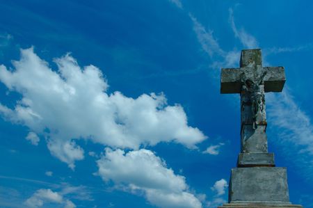 stone cross on skyの写真素材