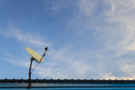 Satellite dish stand on the roof の写真素材