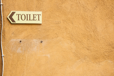 Signs on bathroom walls and brown.の写真素材