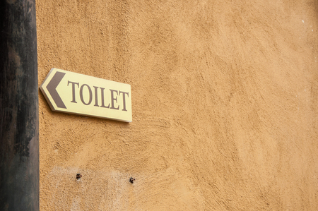 Signs on bathroom walls and brown.の写真素材