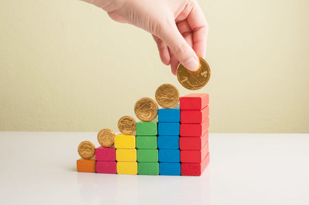 graph from block wood with hand and money concept