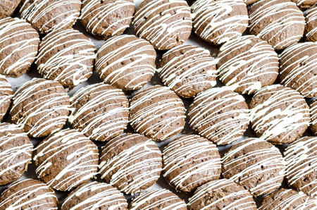 Brown cookies with white chocolate stripesの写真素材
