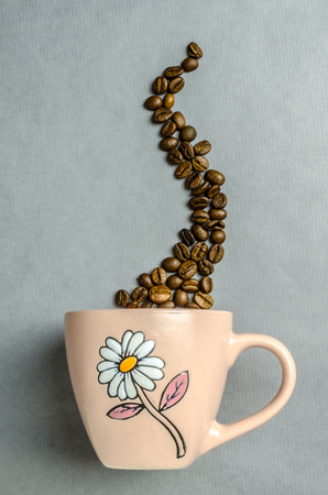 Coffee cup with coffee beansの写真素材