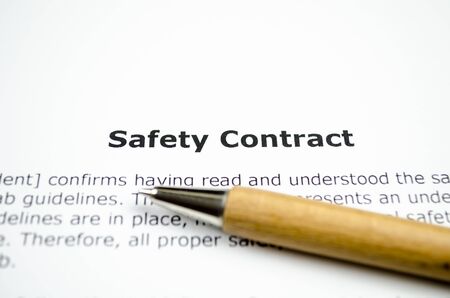 Safety contract with wooden penの写真素材