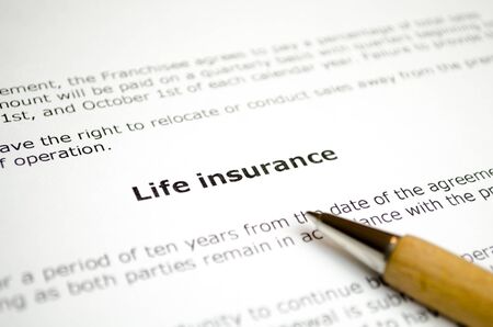 Life insurance with wooden penの写真素材