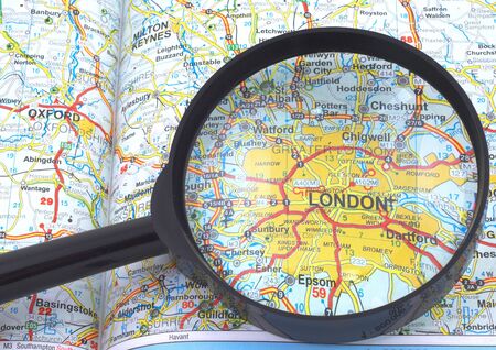 London under magnifying glass on open bookの写真素材