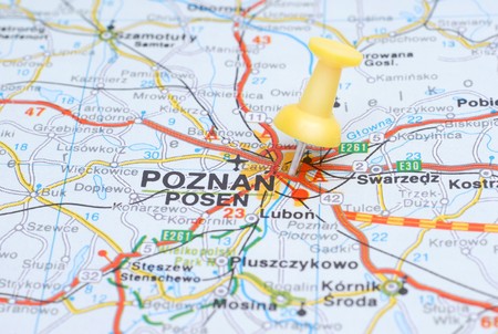Poznan, Poland on a map pinpointed by a yellow thumb tackの写真素材