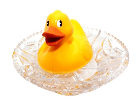 Yellow rubber ducking  in a crystal vase with waterの写真素材