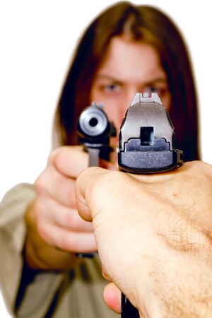 a young man aiming a gunの写真素材