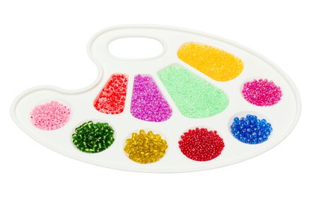 palette with bright colored beads of different shapesの写真素材
