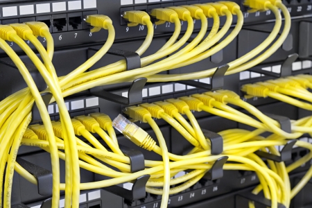 Patch Panel server rack with yellow cords の写真素材