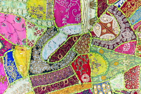 Tibetan embroidery of traditional ornament in the background