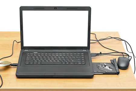 laptop on a table with an open drive isolated on white background