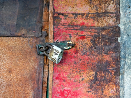 Old vintage padlock on the door of the barnの写真素材
