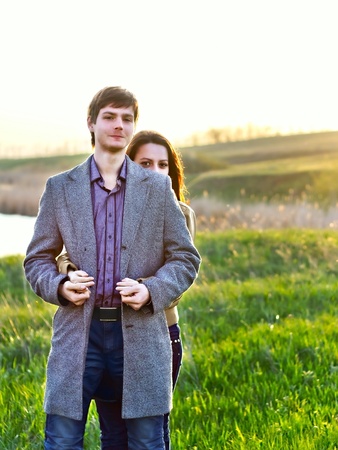 Happy young couple in the spring park. Family outdoorsの写真素材