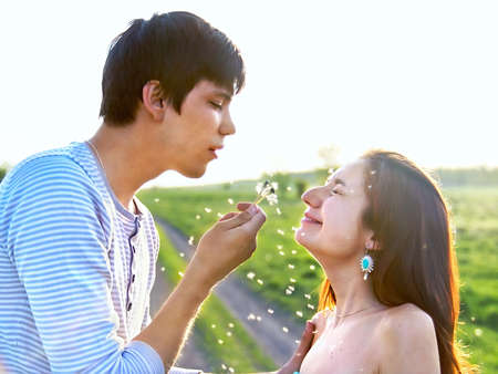 young couple have fun outdoors in summerの写真素材