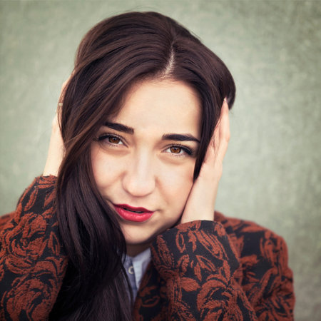 Portrait of young sensual brunette girl outdoors