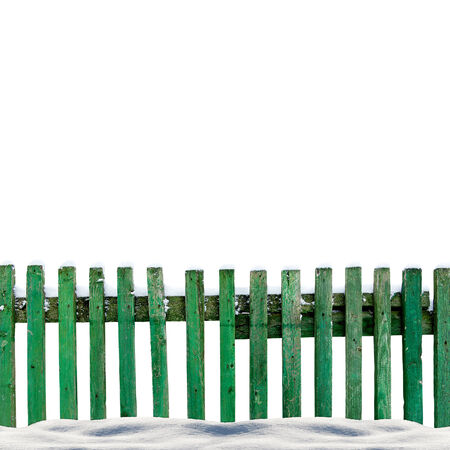 snowy old green wooden fence isolaten on white backgroundの写真素材