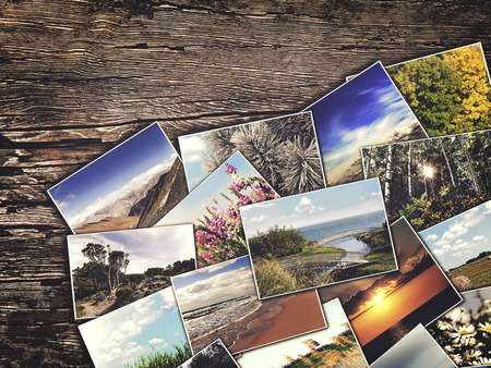 old vintage photos on a wooden backgroundの写真素材