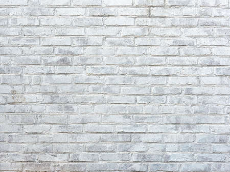 old white brick wall as backgroundの写真素材